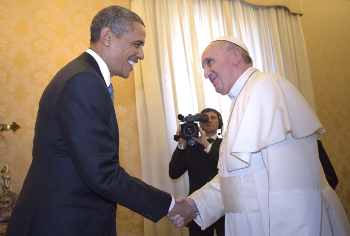 U.S. President Barack Obama shakes hands with Pope Francis during a private audience Thursday at the Vatican. (CNS/Stefano Spaziani, pool)