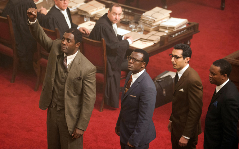 From left, Idris Elba, Tony Kgoroge, Riaad Moosa and Thapelo Mokoena star in a scene from "Mandela: Long Walk to Freedom." (CNS/Weinstein)