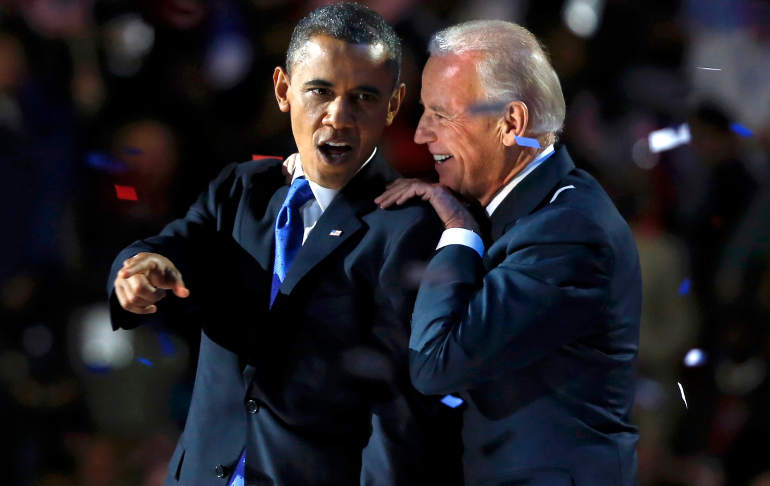 U.S. President Barack Obama and Vice President Joe Biden appear on stage during their election victory rally in Chicago Nov. 7. They return to office for a second term after defeating Republican challengers Mitt Romney and Paul Ryan. (CNS photo/Larry Dow ning, Reuters)