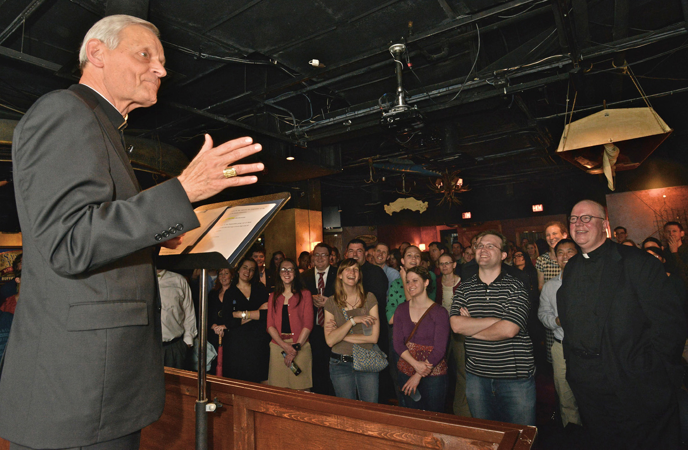 Cardinal Donald Wuerl of Washington addresses young adults May 7 during a Theology on Tap talk at Buffalo Billiards pub in Washington. Theology on Tap is an informal get-together aimed at Catholic young adults. (CNS photo: Michael Hoyt, Catholic Standard)