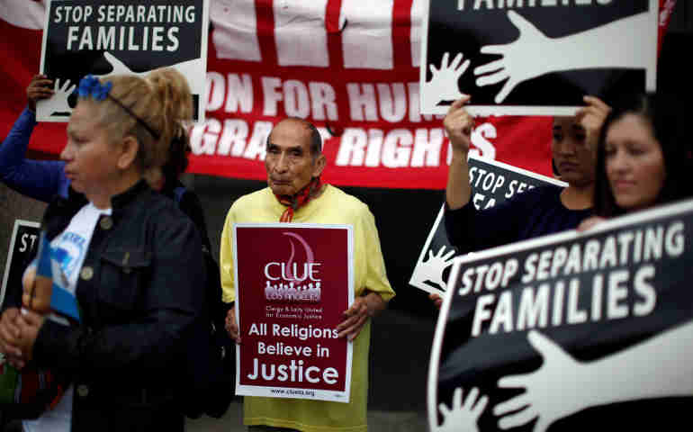People protest May 17 in Los Angeles against plans to deport Central American asylum seekers. (CNS/Reuters)