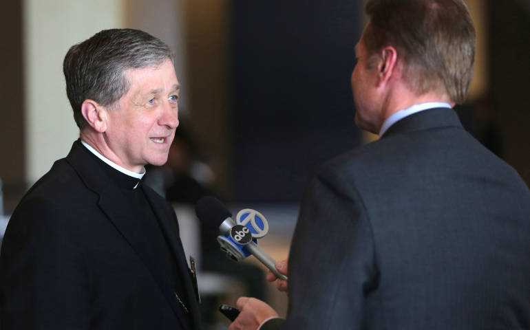 Bishop Blase Cupich talks with a reporter June 11 at the meeting of the U.S. bishops in New Orleans. (CNS/Bob Roller)