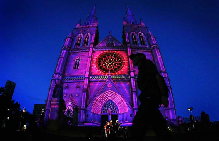 St. Mary's Cathedral is illuminated by a 246-foot projected Lights of Christmas display Dec. 13 in Sydney. The Archdiocese of Sydney and Australian Catholic University are presenting the show through Christmas Day. (CNS photo/Tim Wimborne, Reuters)