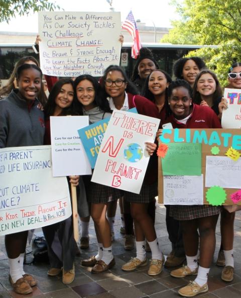 Juniors and seniors from environmental science classes at Elizabeth Seton High School, a girls school in Bladensburg, Maryland, stand with their climate change signs along Constitution Avenue in Washington Sept. 20, 2019. (CNS) Juniors and seniors from environmental science classes at Elizabeth Seton High School, a girls school in Bladensburg, Maryland, stand with their climate change signs along Constitution Avenue in Washington Sept. 20, 2019. (CNS)