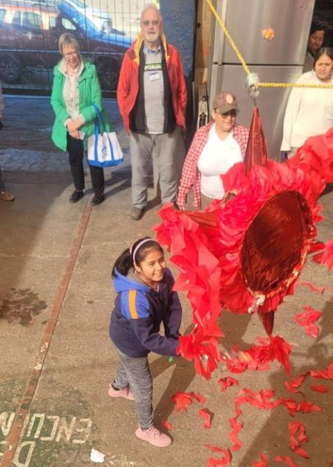 A child breaks a piñata at a shelter in Mexicali, Mexico.