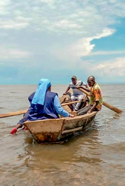 Sr. Angèle Gapio crosses a river in a canoe to meet the rebels to seek possibilities of peaceful negotiations within Congo (Courtesy of Dieu Donne, Pax Christi International.)