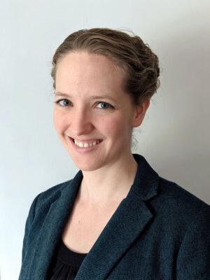 Sarah Kathleen Johnson, Assistant Professor of liturgy and pastoral theology at St. Paul University in Ottawa, Ontario. Headshot of Johnson smiling.