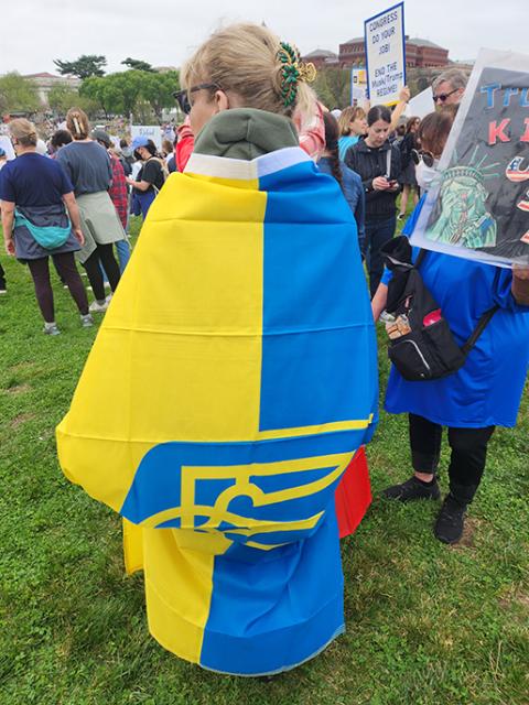  Sheri Minix, a resident of San Diego, who came to Washington expressly for the demonstration had a Ukrainian flag draped around her shoulders. 