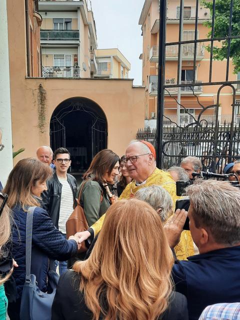 Cardinal Timothy M. Dolan of New York speaks with parishioners after he celebrated Mass at Our Lady of Guadalupe Church, his titular church in Rome, May 4, 2025. (CNS photo/Carol Glatz)