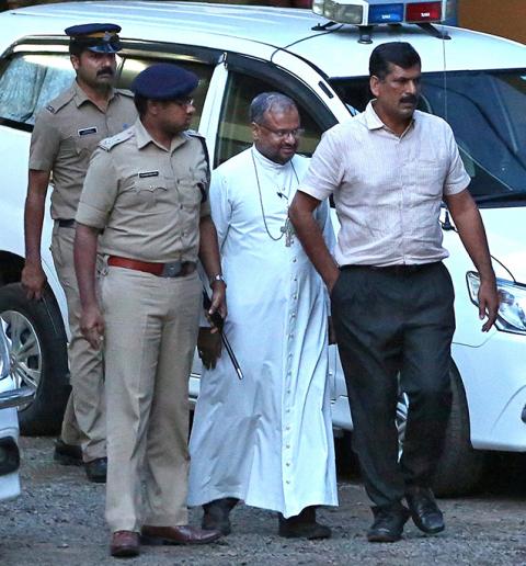 Bishop Franco Mulakkal of Jalandhar, India, is led away for questioning by police Sept. 19, 2018, on the outskirts of Cochin. (CNS/Reuters/Sivaram V)
