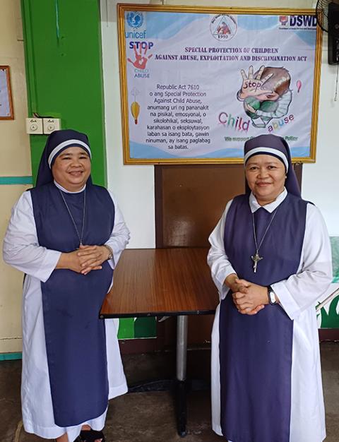 Mother Jovelyn Adcan (left) and Sr. Lerry Tapales care for sexually abused and impoverished children at the Holy Trinity Home for Children in Quezon City, Philippines. (Oliver Samson)