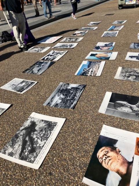Photos of atomic bomb victims on sidewalk Photos of atomic bomb victims on sidewalk