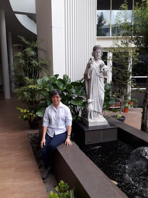 Good Shepherd Sr. Agnes-Claire Koh sits outside by the Good Shepherd statue in front of the chapel (Provided photo) Good Shepherd Sr. Agnes-Claire Koh sits outside by the Good Shepherd statue in front of the chapel (Provided photo)