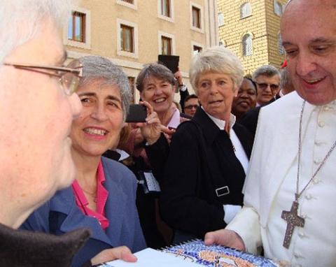 Good Shepherd Sr. Marie-Hélène Halligon, left, presents the Lampedusa mosaic to Pope Francis. (Courtesy of Marie-Hélène Halligon) Good Shepherd Sr. Marie-Hélène Halligon, left, presents the Lampedusa mosaic to Pope Francis. (Courtesy of Marie-Hélène Halligon)