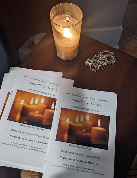 Programs set out for a collaborative young adult Taizé and happy hour event hosted in June 2022 by Catholic Climate Covenant and Old St. Patrick's Catholic Church in Chicago. (Courtesy of Anna Robertson) Programs set out for a collaborative young adult Taizé and happy hour event hosted in June 2022 by Catholic Climate Covenant and Old St. Patrick's Catholic Church in Chicago. (Courtesy of Anna Robertson)