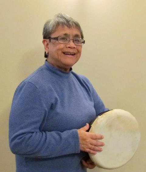Sr. Terri Laureta playing a hand drum (Courtesy of Terri Laureta) Sr. Terri Laureta playing a hand drum (Courtesy of Terri Laureta)