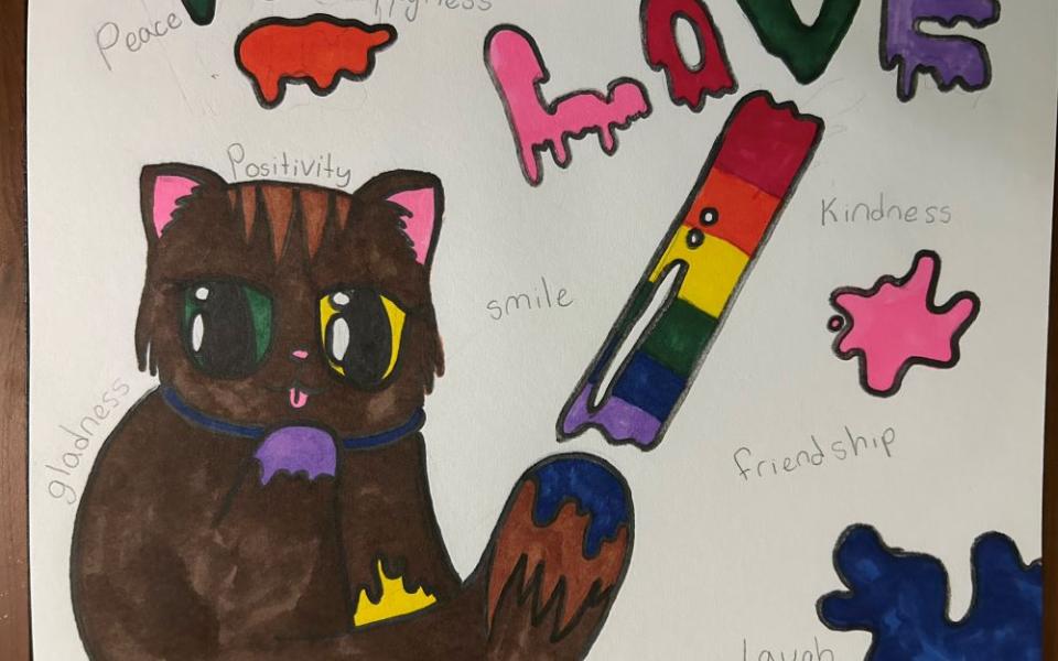 Child's drawing shows cat and the word love.