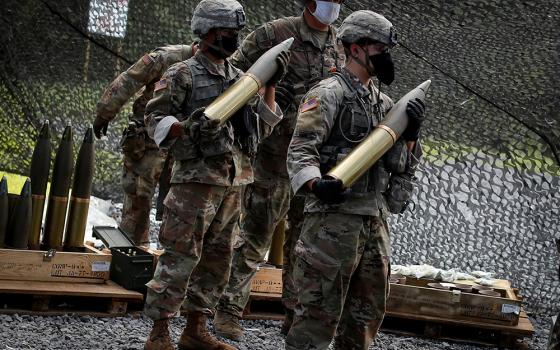 U.S. Military Academy cadets wait to load live 105 mm shells into an M119 105 mm Howitzer artillery weapon during tactical and physical training activities Aug. 7, 2020, at West Point, New York. (CNS/Reuters/Mike Segar)