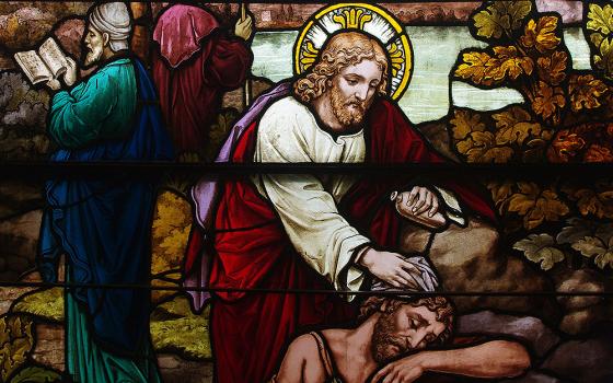 A stained glass window at St. Henry Catholic Church in St. Henry, Ohio, depicts Christ as the good Samaritan. (Wikimedia Commons/Nheyob)