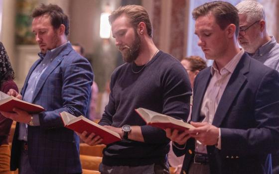 three men at Mass