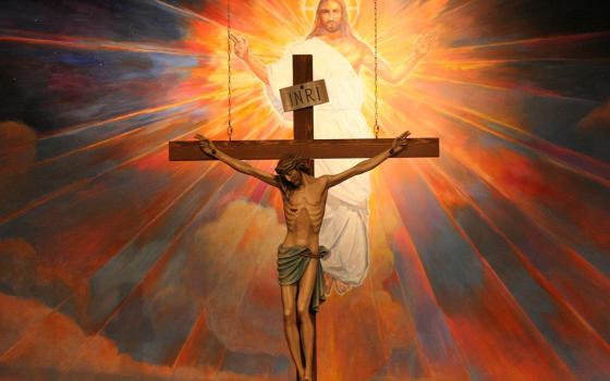 A crucifix hangs before a mural depicting the Resurrection in the sanctuary at St. Timothy Parish in Mesa, Arizona, in this undated file photo. (OSV News/Catholic Sun/J.D. Long-Garcia)