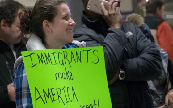 "Immigrants make America great" sign at protest