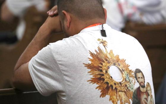A man prays during perpetual adoration at St. John the Evangelist Church in Indianapolis during the opening of the National Eucharistic Congress July 17, 2024. (OSV News photo/Bob Roller)