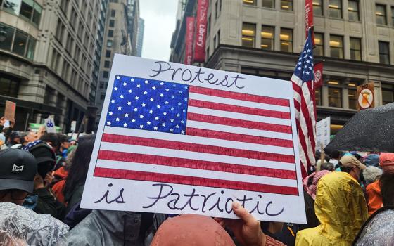 Signs appealing to patriotism and American values were common during the June 14 "No Kings" demonstration in Midtown Manhattan, N.Y. (GSR photo/Chris Herlinger)
