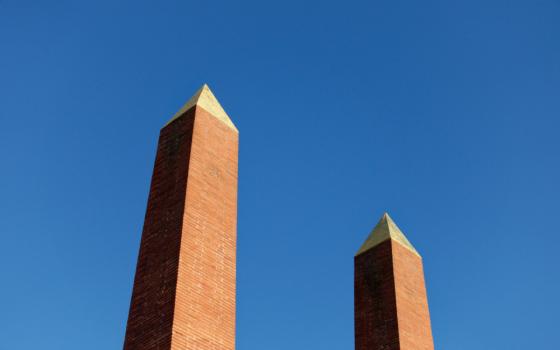 2 pillars against a very blue sky