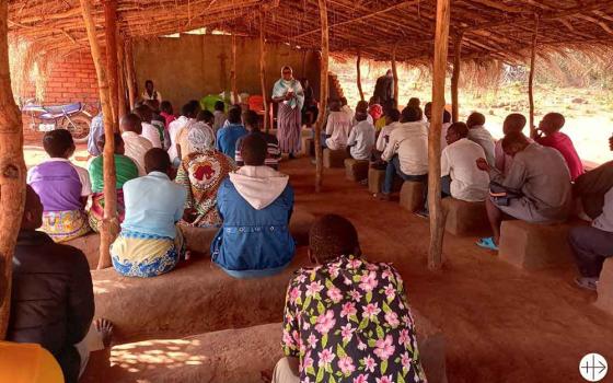 Under a thatched roof chapel, Catholics in a rural Mozambican village gather for catechism and community outreach led by local religious sisters. (Courtesy of Aid to the Church in Need)
