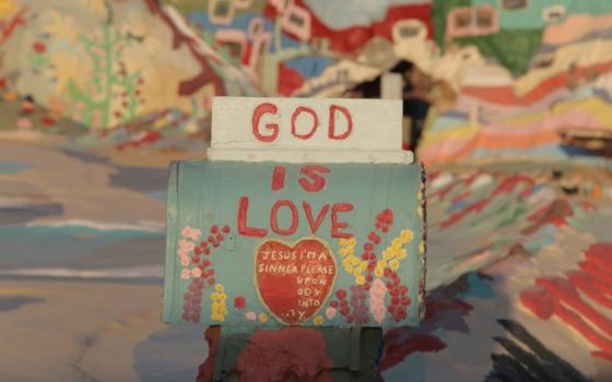 Artwork says "God is Love."
