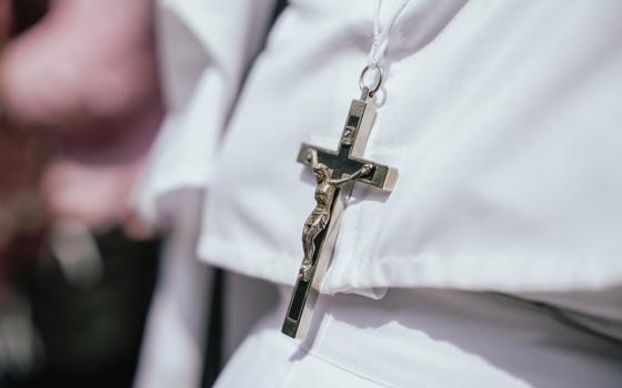 An unidentified nun wears a crucifix and her habit at a Good Friday procession on March 29, 2024, in Guwahati, Assam, India. (Dreamstime/Talukdardavid)