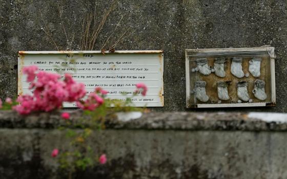 A memorial is seen July 7 in Tuam, Ireland, where an excavation is underway for the remains of 796 babies  at the site of a former mother-and-baby home run on behalf of the Irish government by the Catholic Sisters of Bon Secours. The home closed its doors in 1961. (OSV News/Reuters/Clodagh Kilcoyne)