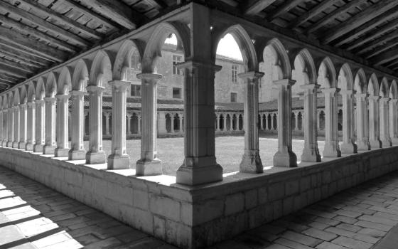 Courtyard surrounded by open arched windows 