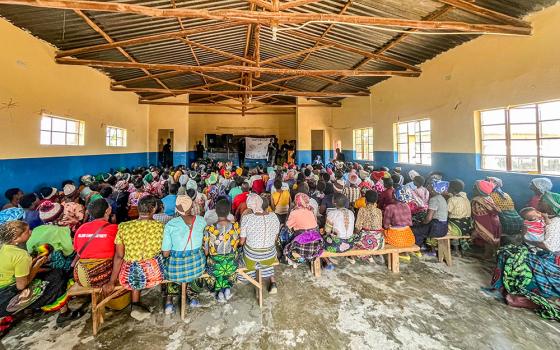 Community members in Malawi listen to a Watts of Love financial literacy training before receiving solar lights during a four-day session at Mponela Lodge in October 2025. The training focuses on saving money formerly spent on kerosene or batteries, investing in livestock and using extended hours of light to generate additional income. (Courtesy of Watts of Love)
