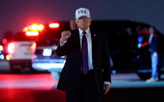 U.S. President Donald Trump pumps his fist after disembarking Air Force One at Palm Beach International Airport in West Palm Beach, Florida, Feb. 27, 2026. (OSV News/Reuters/Elizabeth Frantz)