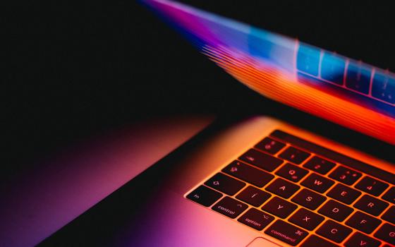 Laptop opening (Unsplash/Andras Vas)